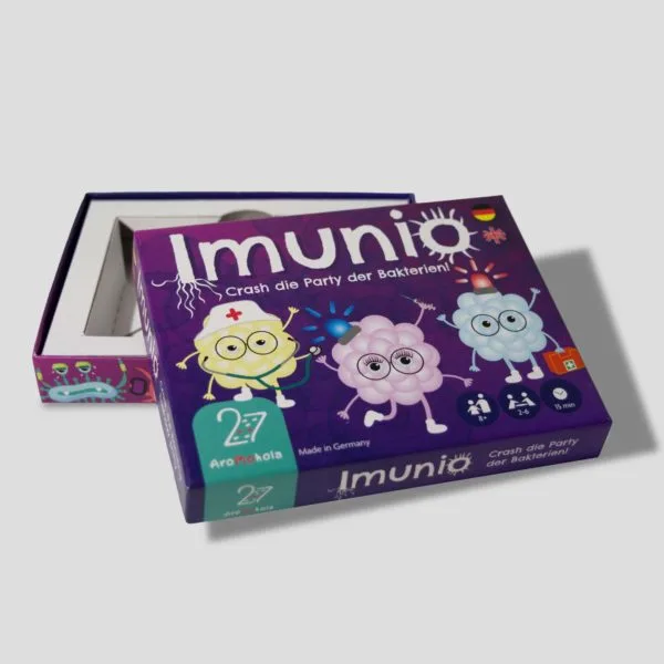 Open box of Imunio displaying colorful playing cards and game components ready for action.