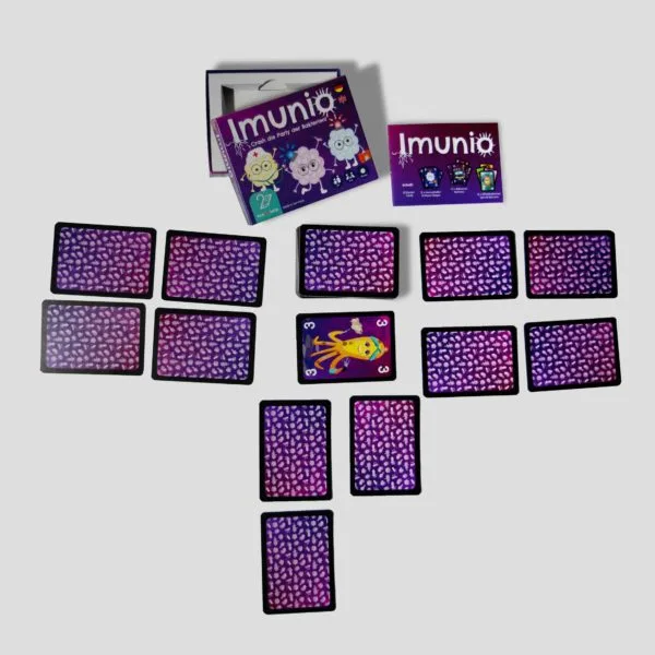 Example of Imunio gameplay, showing players using cards to stop bacteria from celebrating their party inside the body.
