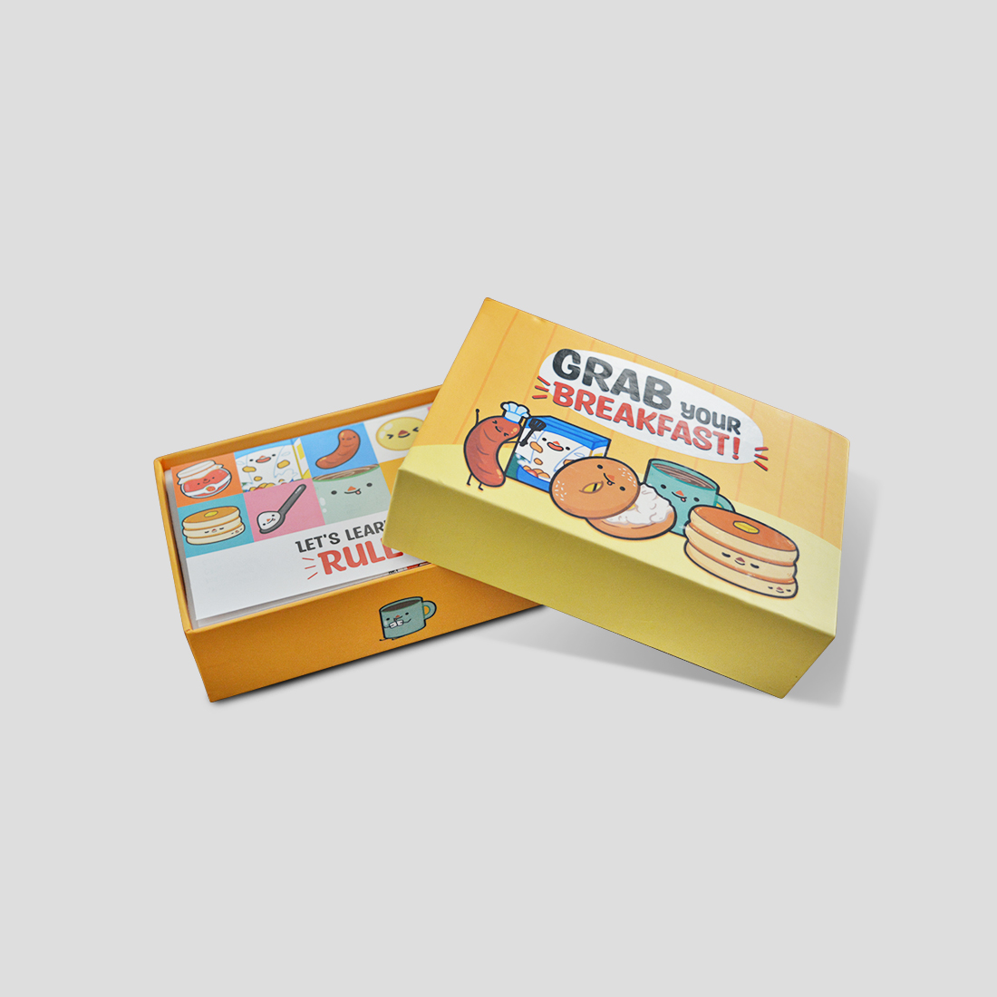 The opened Grab Your Breakfast box showing food cards and tokens.